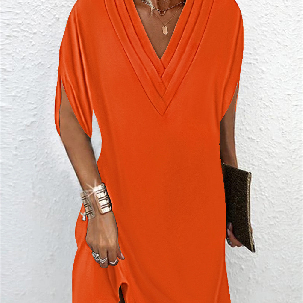 Robe fluide élégante, manches fendues, coupe estivale.  Parfait pour les occasions spéciales.
