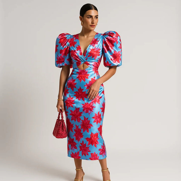 Robe imprimée, manches bouffantes, décolleté V.  Style chic et féminin.