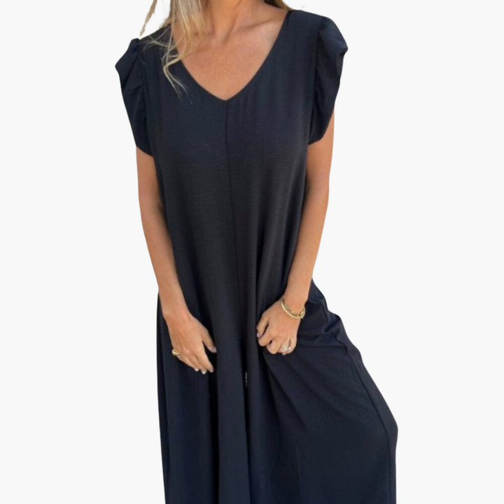 "Robe longue à col V avec imprimé léopard, élégante et audacieuse, sublimant la silhouette féminine pour toutes occasions."
