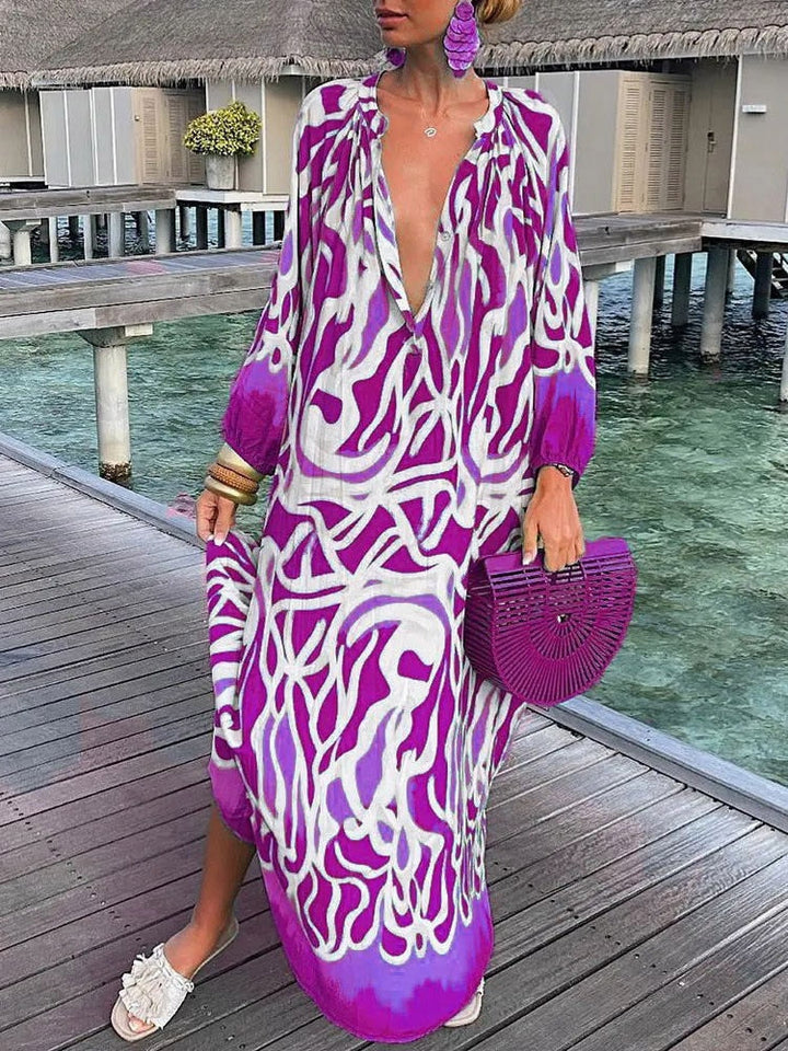 Robe longue femme imprimée style boho chic, fluide, col V, manches longues, idéale pour l'été et la plage.