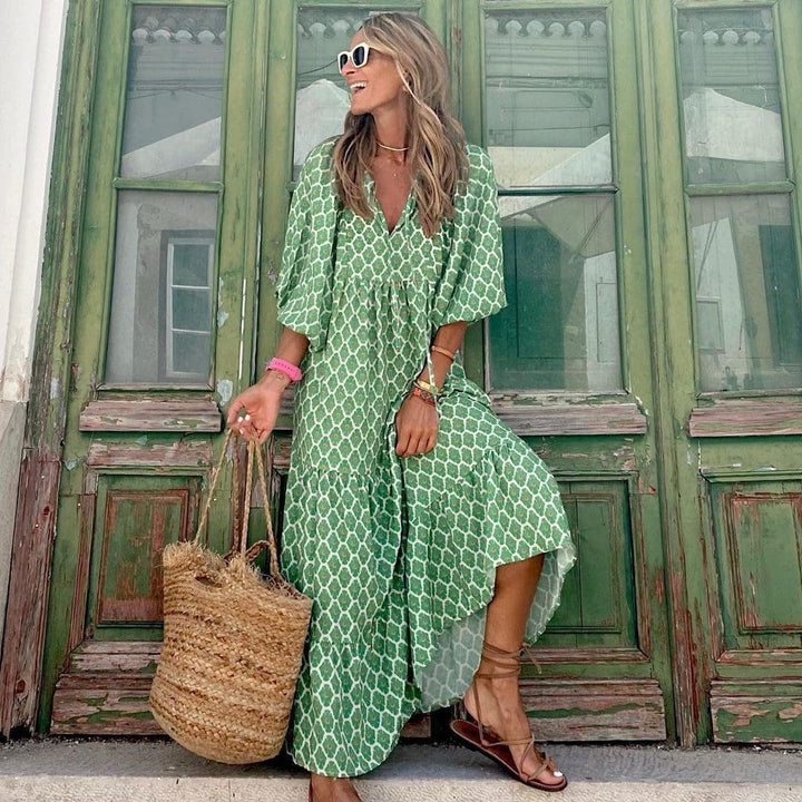 "Robe longue bohème imprimé vintage, col en V, manches courtes, style fluide et élégant pour femme."