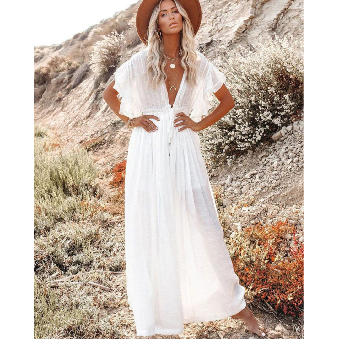 "Robe longue d'été fluide et élégante pour femme, couleur claire, style ample, parfaite pour les journées chaudes."