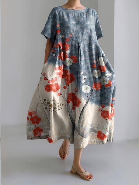 "Robe longue en lin beige clair avec motif floral coloré, coupe ample, manches courtes pour confort estival"