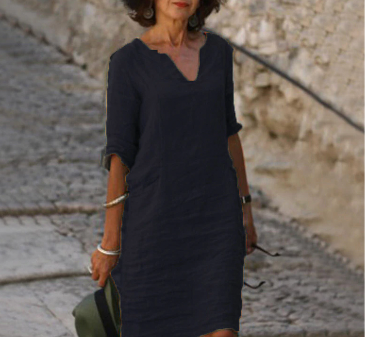 Robe longue en lin, manches longues, col V.  Coupe fluide et élégante.  Parfait pour un style décontracté chic.