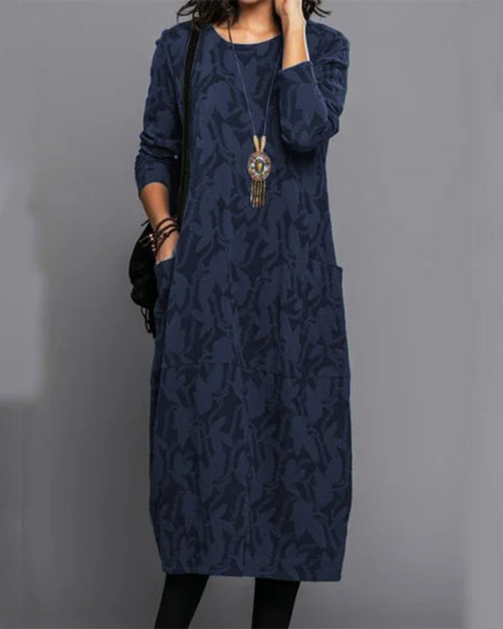 Élégante robe longue fleurie pour femme, manches longues, idéale pour détente ou quotidien. Avec poches discrètes.