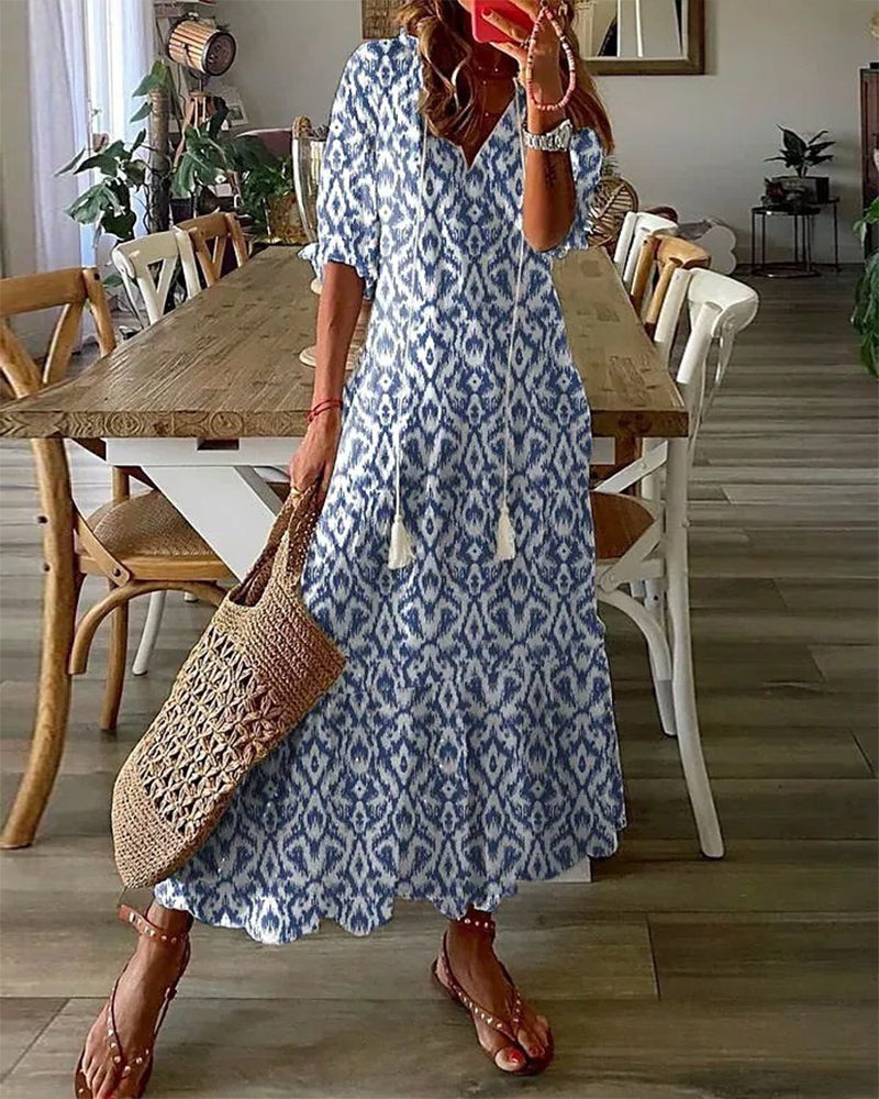 Robe longue fluide pour femme, motif floral, col V, idéale pour l'été et les occasions décontractées.