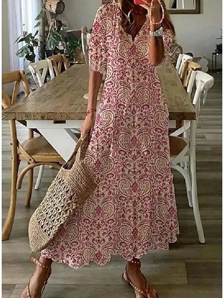 Robe femme élégante, coupe longue et fluide, imprimé coloré, parfaite pour les journées d'été et le printemps.
