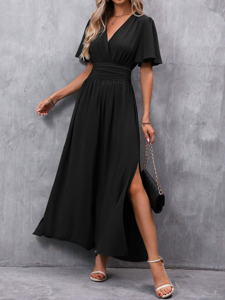 Robe longue fluide femme avec ceinture flatteuse, idéale pour gala et mode chic. Silhouette élégante.