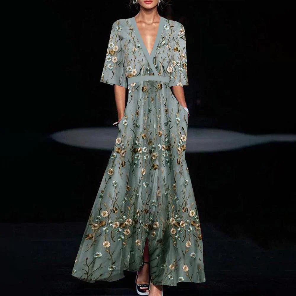 Robe longue verte, maxi, demi-manches. Coupe fluide et élégante, idéale pour toutes occasions.