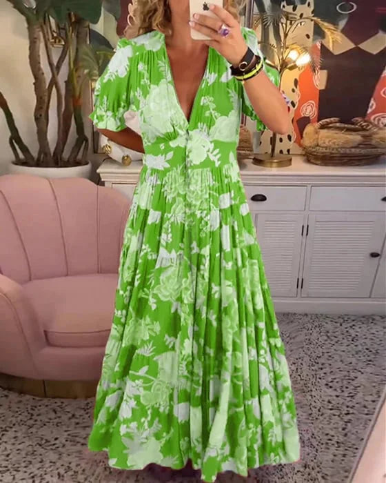 Robe maxi à col V imprimé floral, manches courtes bouffantes, style ligne A, élégance estivale féminine.
