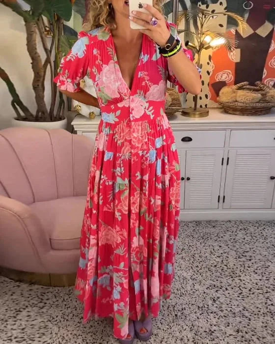 Robe maxi à col V imprimé floral, manches courtes bouffantes, style ligne A, élégance estivale féminine.