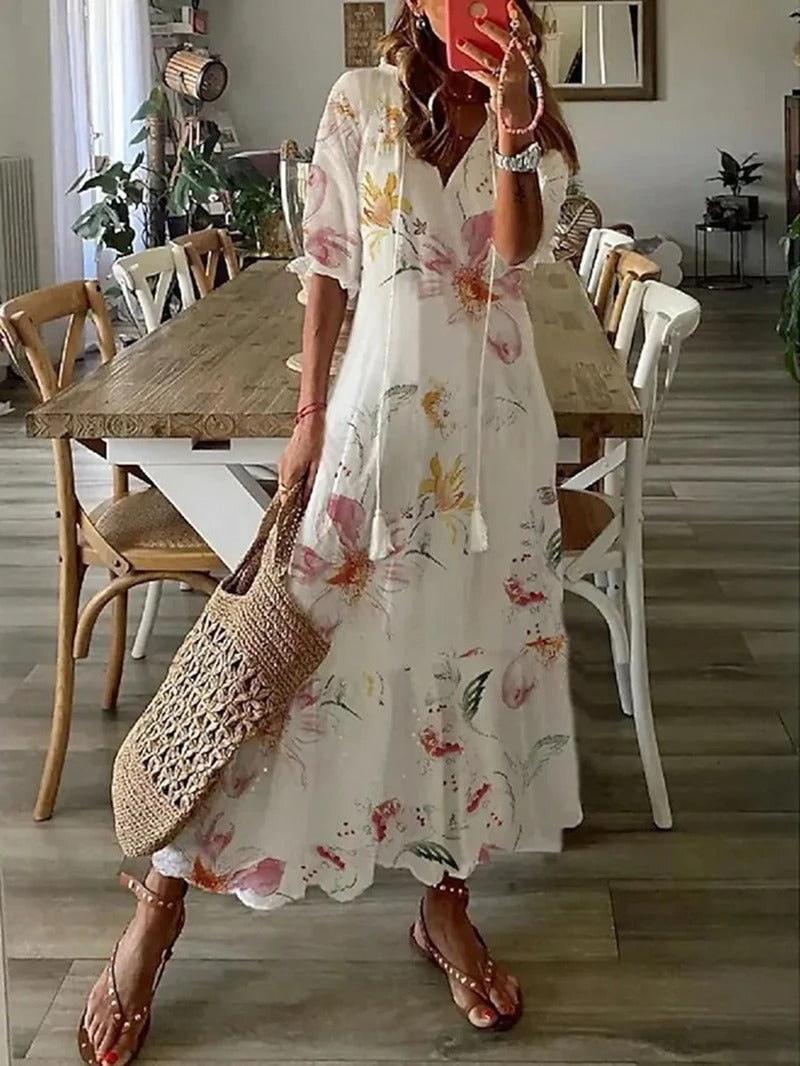 Robe maxi bohème fluide, imprimé estival. Coupe ample et confortable.  Idéale pour l'été.