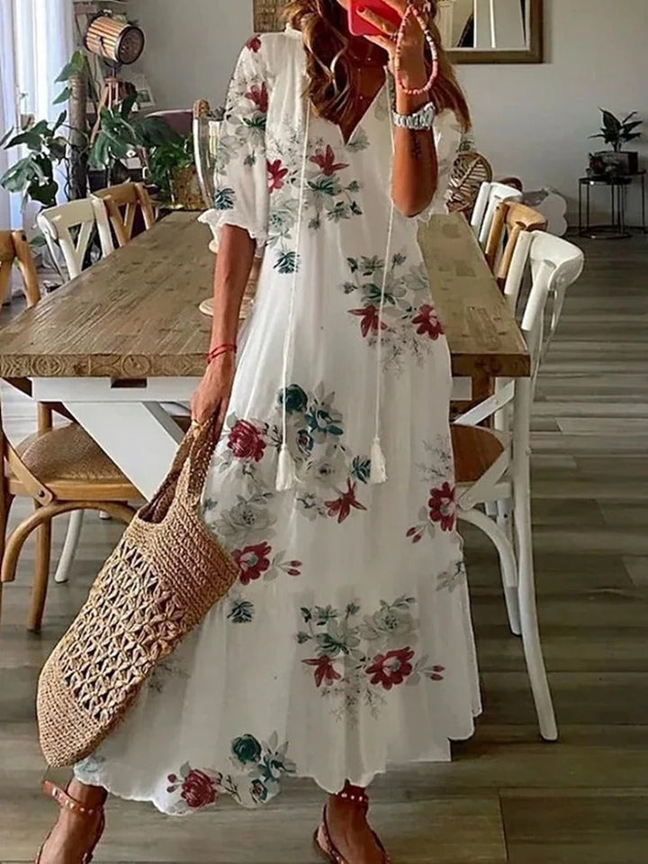 Robe maxi bohème fluide, imprimé estival. Coupe ample et confortable.  Idéale pour l'été.