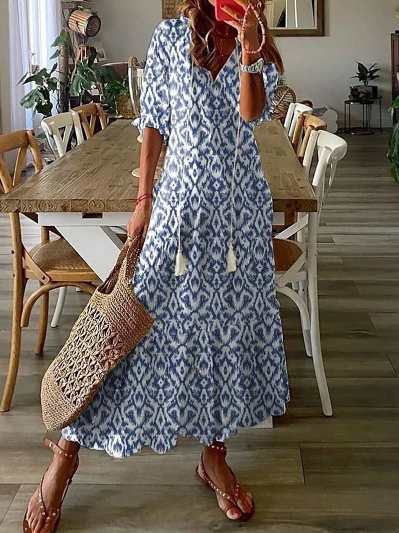 Robe maxi bohème fluide, imprimé estival. Coupe ample et confortable.  Idéale pour l'été.