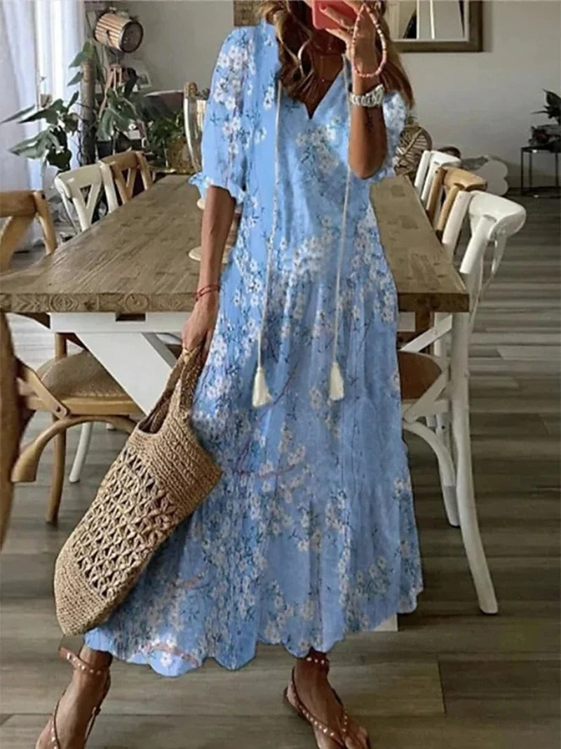 Robe maxi bohème fluide, imprimé estival. Coupe ample et confortable.  Idéale pour l'été.