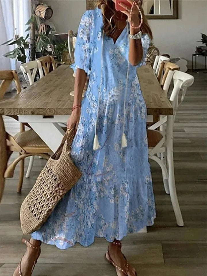 Robe maxi bohème fluide, imprimé estival. Coupe ample et confortable.  Idéale pour l'été.