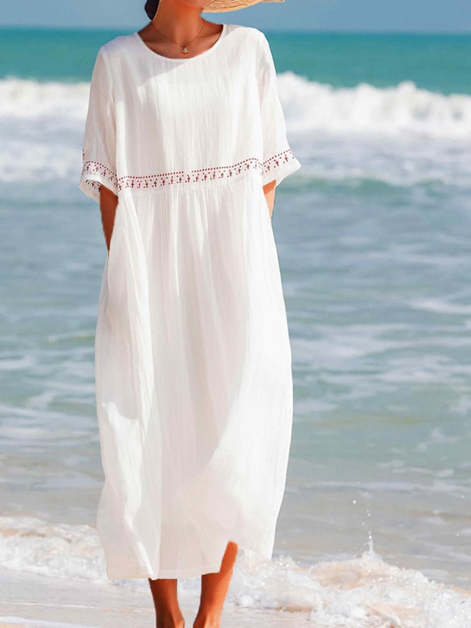 Robe longue fluide et brodée pour femme, style estival décontracté et confortable pour les vacances.