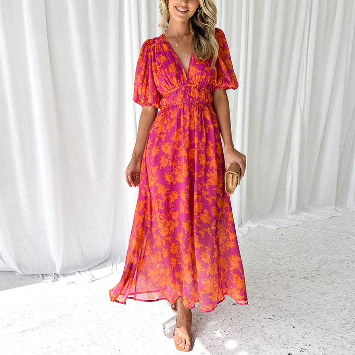 Robe maxi femme élégante col V évasée, idéale pour un mariage d'été ou une soirée chic.