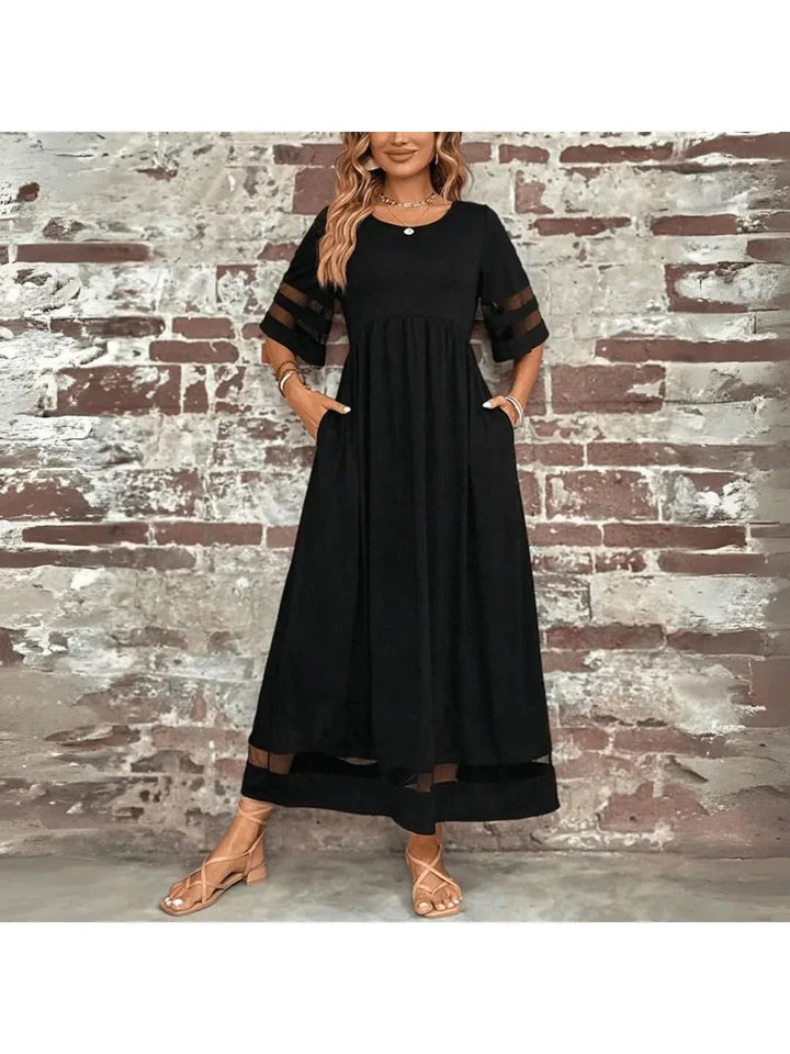 Robe longue femme avec poches, silhouette évasée, idéale pour le confort quotidien et la mode féminine printemps-été.