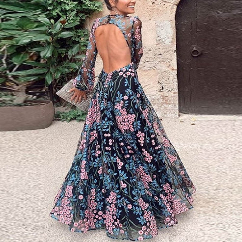 Robe de cocktail maxi fleurie vintage Saturnina pour femme, coupe chic dos nu. Parfaite pour l'été, événement élégant.