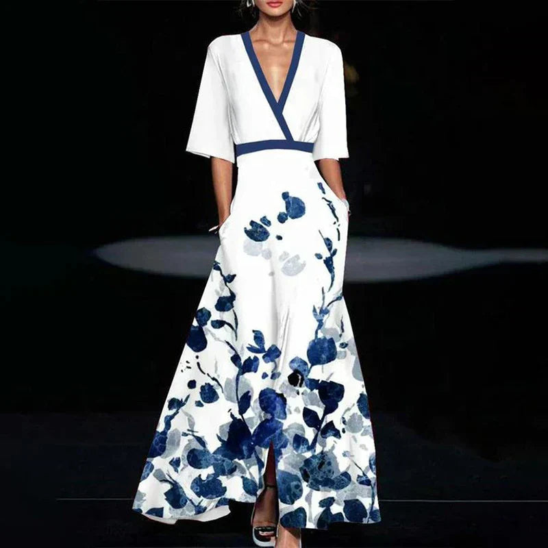 Robe maxi fluide, imprimé floral élégant, col V, manches 3/4.  Parfaite pour toutes occasions.