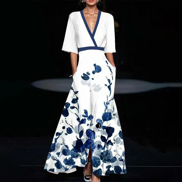 Robe maxi fluide, imprimé floral élégant, col V, manches 3/4.  Parfaite pour toutes occasions.