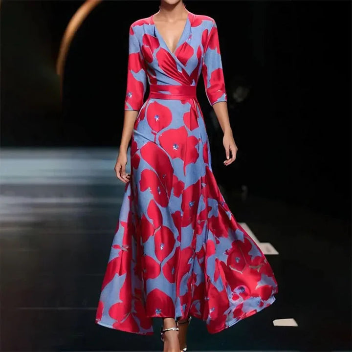 Robe maxi fluide, imprimé floral élégant, col V, manches 3/4.  Parfaite pour toutes occasions.