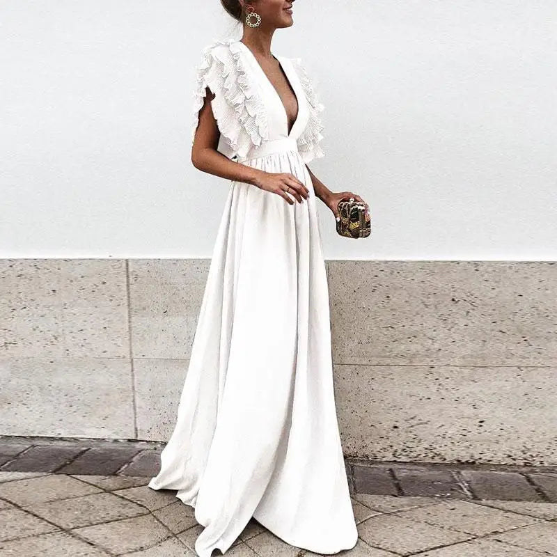 Robe maxi fluide, volants élégants, coupe cintrée.  Parfait pour les occasions spéciales.