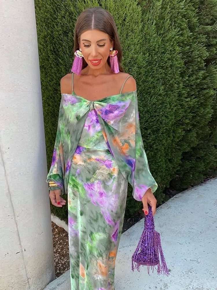 Robe de cocktail femme fluide, dos ouvert, motif halo. Idéale pour l'été, soirée élégante et tendance.