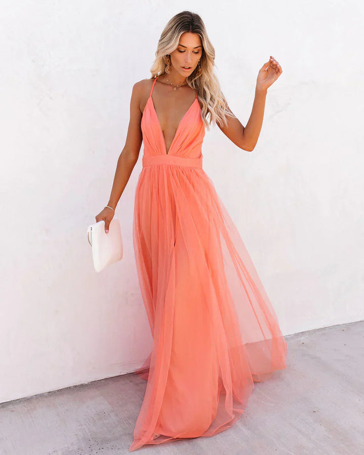Robe maxi orange fluide, coupe élégante et cintrée. Idéale été.
