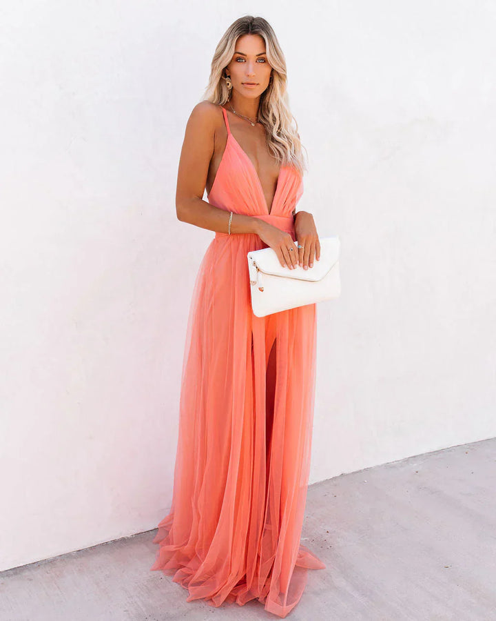 Robe maxi orange fluide, coupe élégante et cintrée. Idéale été.