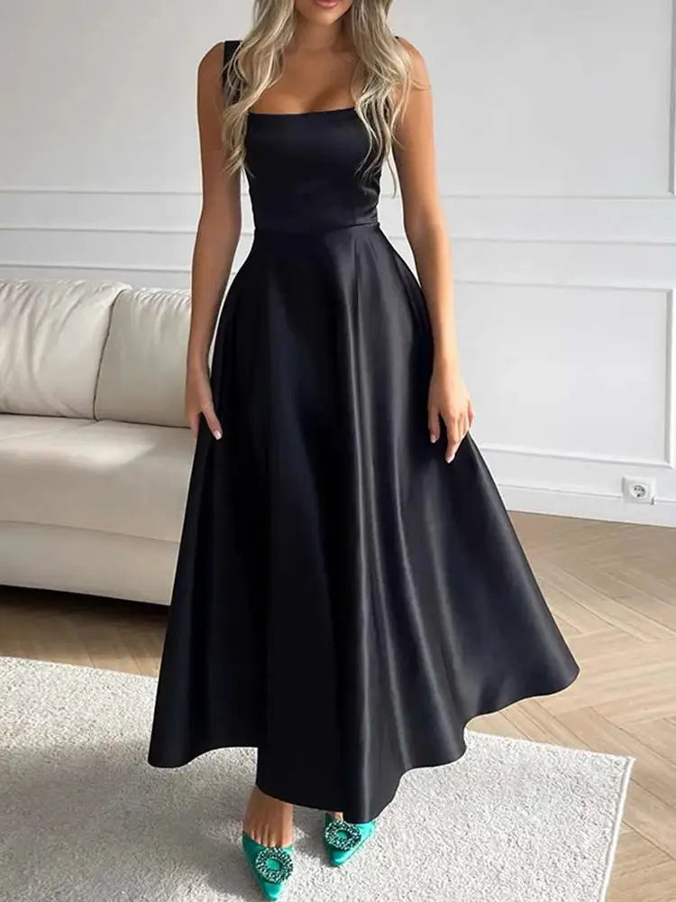 Robe de soirée trapèze, coupe évasée pour femme. Tenue élégante pour invitée mariage ou bal. Mode féminine.