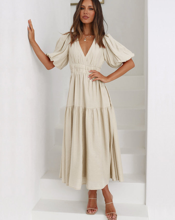 Robe longue de soirée femme, élégante et fluide, col en V, manches bouffantes, pour événement chic.