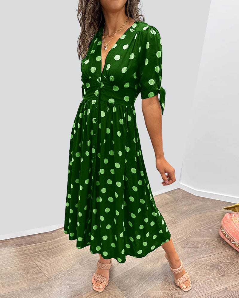 "Robe mi-longue à pois, manches nouées, coupe cintrée, imprimé rétro, parfaite pour occasions élégantes."