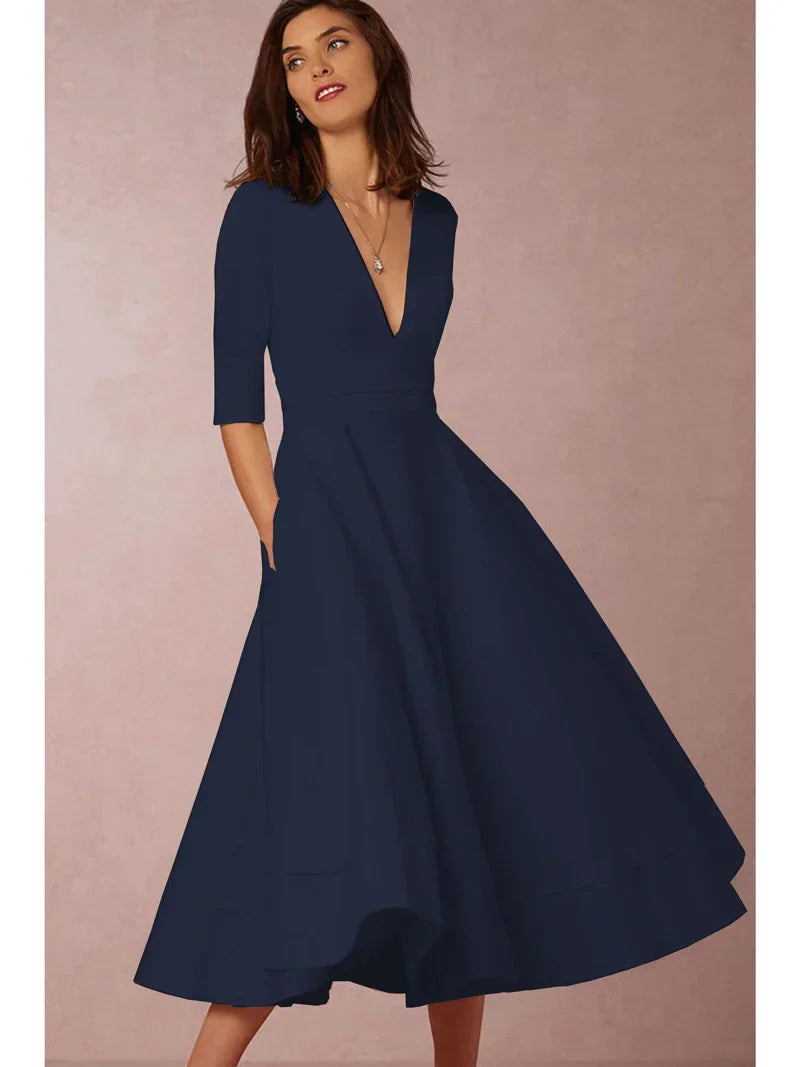 Robe midi A-ligne élégante, décolleté V, tissu luxueux.  Coupe flatteuse et confortable.