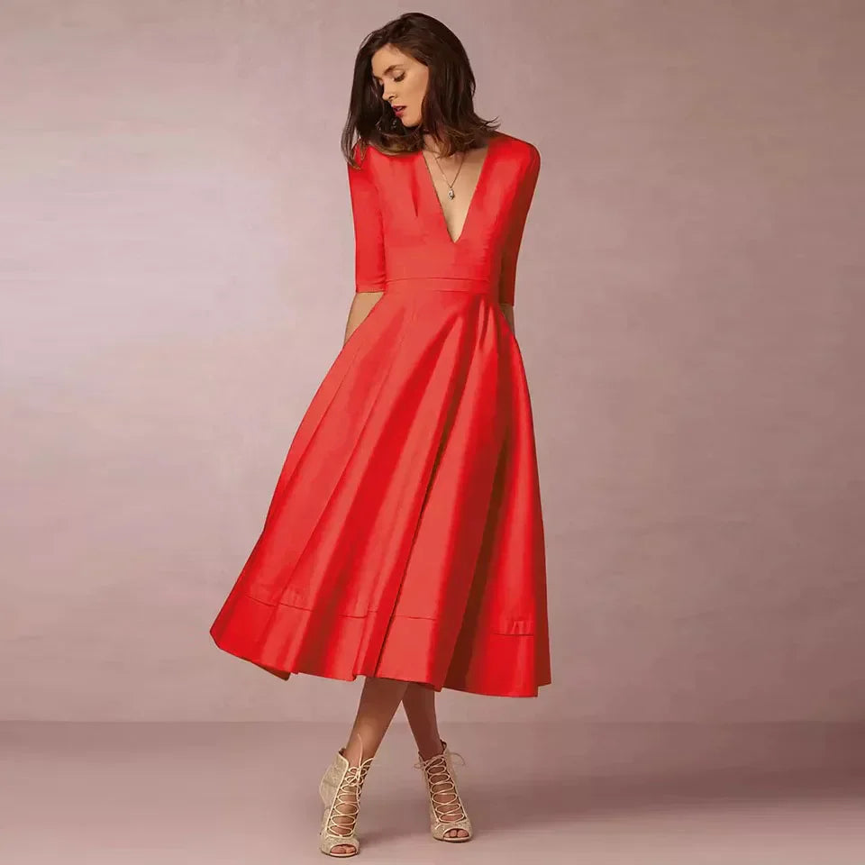 Robe midi A-ligne élégante, décolleté V, tissu luxueux.  Coupe flatteuse et confortable.