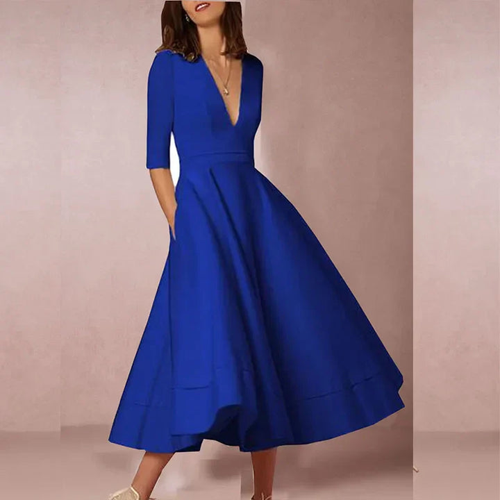 Robe midi A-ligne élégante, décolleté V, tissu luxueux.  Coupe flatteuse et confortable.
