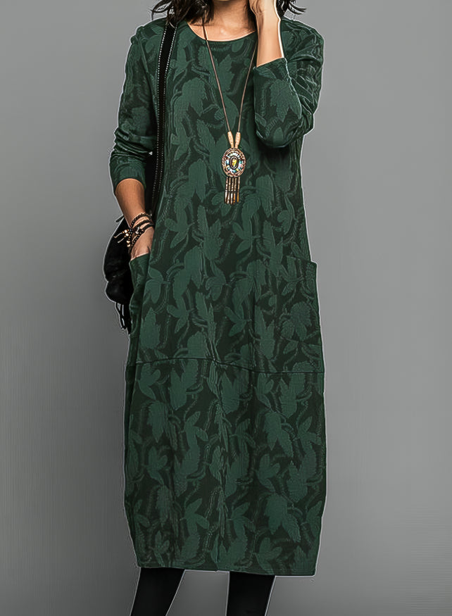Robe midi femme décontractée avec poches et manches longues, coupe ample pour un confort optimal.