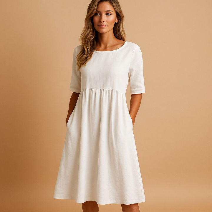 Robe midi ample pour femme, col rond, avec poches. Style décontracté chic et confortable, parfaite pour l'été.