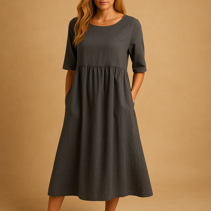 Élégante robe femme midi décontractée, coupe ample, col rond, poches. Idéale pour un look quotidien polyvalent.