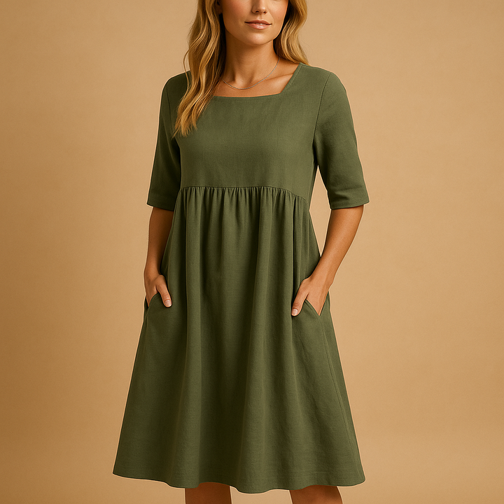 Robe midi ample à poches, col rond, pour femme. Confort optimal et élégance décontractée pour toute occasion.