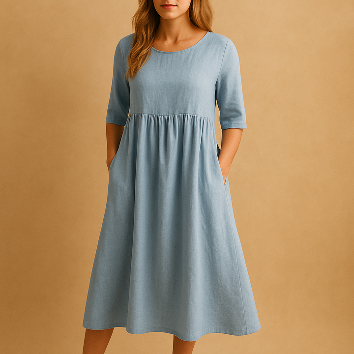 Mode femme: Robe midi ample à col rond, avec poches. Un vêtement confortable et polyvalent pour un style décontracté.