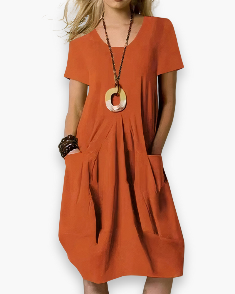 "Robe midi ample pour femme, élégante et fluide, avec poches, parfaite pour un style décontracté et chic, couleur beige."