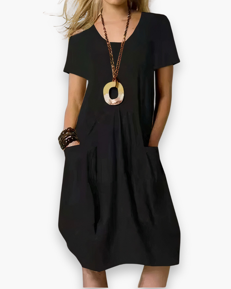 "Robe midi ample pour femme, élégante et fluide, avec poches, parfaite pour un style décontracté et chic, couleur beige."
