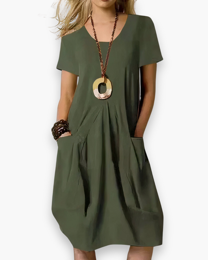"Robe midi ample pour femme, élégante et fluide, avec poches, parfaite pour un style décontracté et chic, couleur beige."
