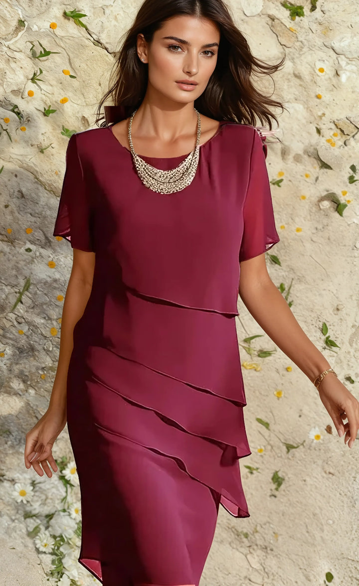 Robe midi femme bohème, coupe fluide et féminine, idéale pour un look chic et polyvalent en été.