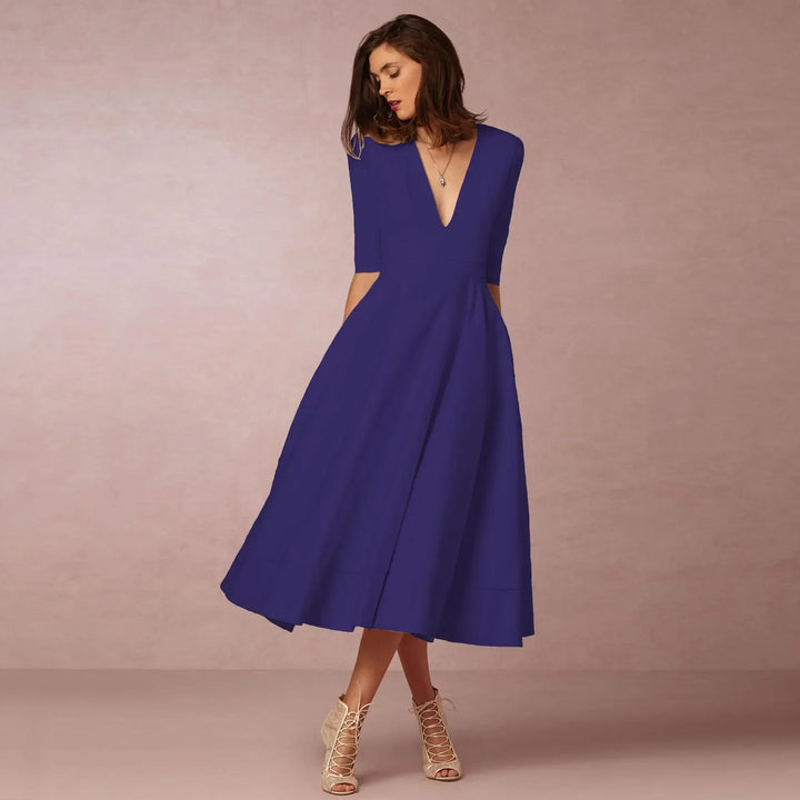 Robe midi confortable et chic, style polyvalent printemps/été, idéale pour femme.