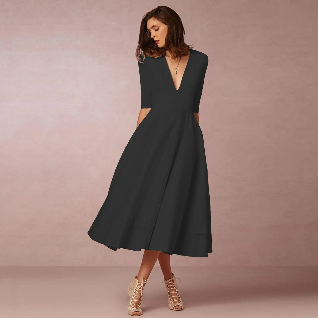 Robe d'été midi cintrée, confortable et légère, parfaite pour la saison chaude et féminine.