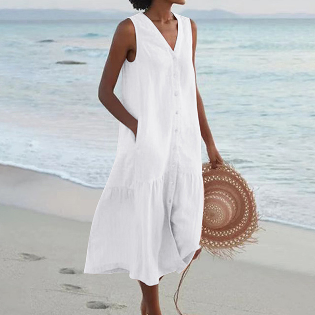 Robe femme midi sans manches, boutonnée devant. Ample et fluide, parfaite pour l'été décontracté.