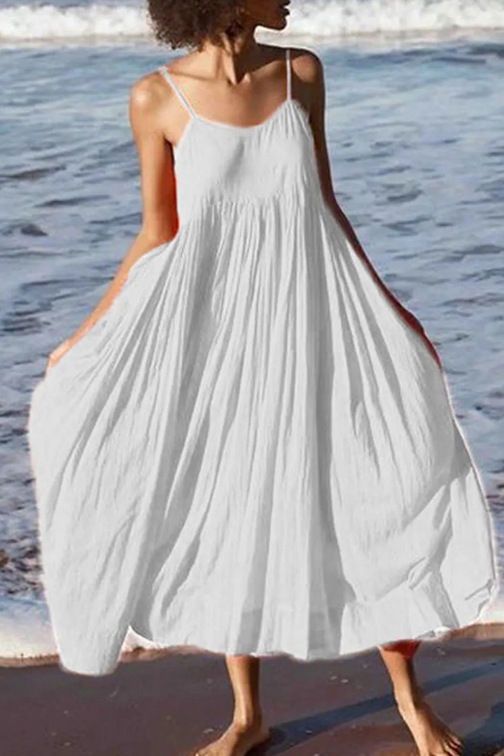 Robe midi d'été légère pour femme, bretelles fines, style décontracté et fluide, parfaite pour la plage ou les vacances.